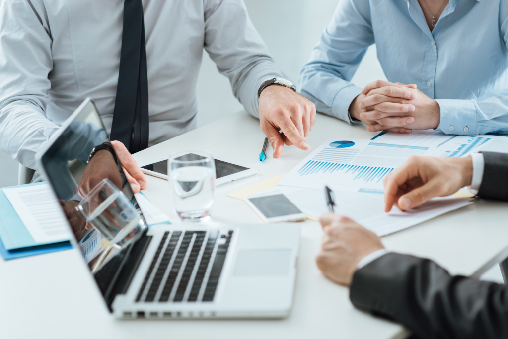 Professional business team working together at office desk